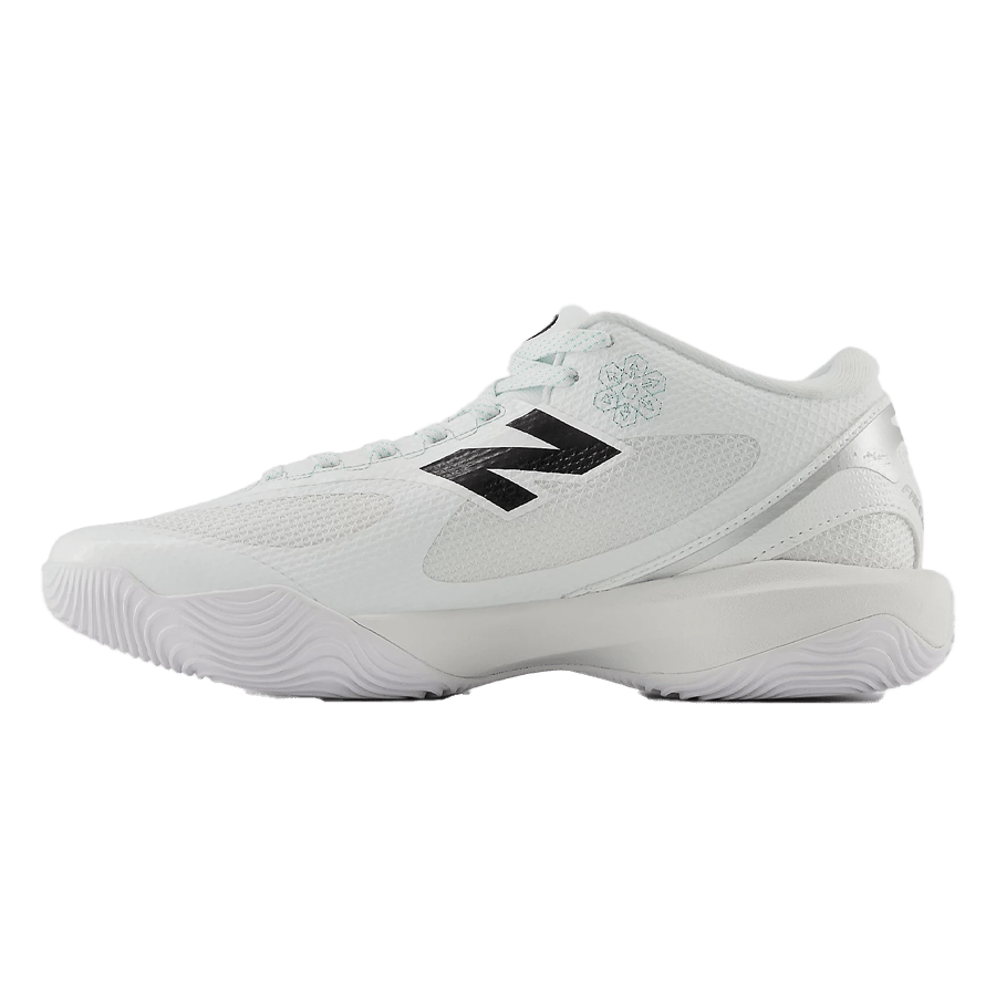 Introducing the New Balance FreezeLX 5 Box Shoes, a stylish white athletic shoe adorned with a prominent black "N" logo and light green accents. Engineered specifically for box lacrosse, it boasts a breathable mesh upper and a wavy sole that provides excellent multi-surface traction. Ideal for those who desire both contemporary style and functionality.